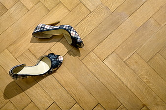 Plaid high heels on wooden parquet floor