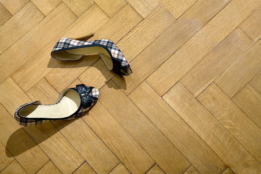 Plaid high heels on wooden parquet floor