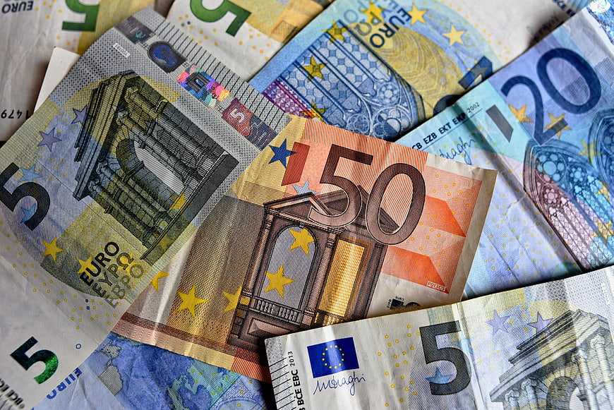 Scattered Euro Banknotes Including 50 and 5 Euro Bills