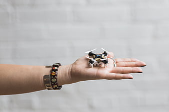 Tiny Mini Drone Held in Woman's Palm