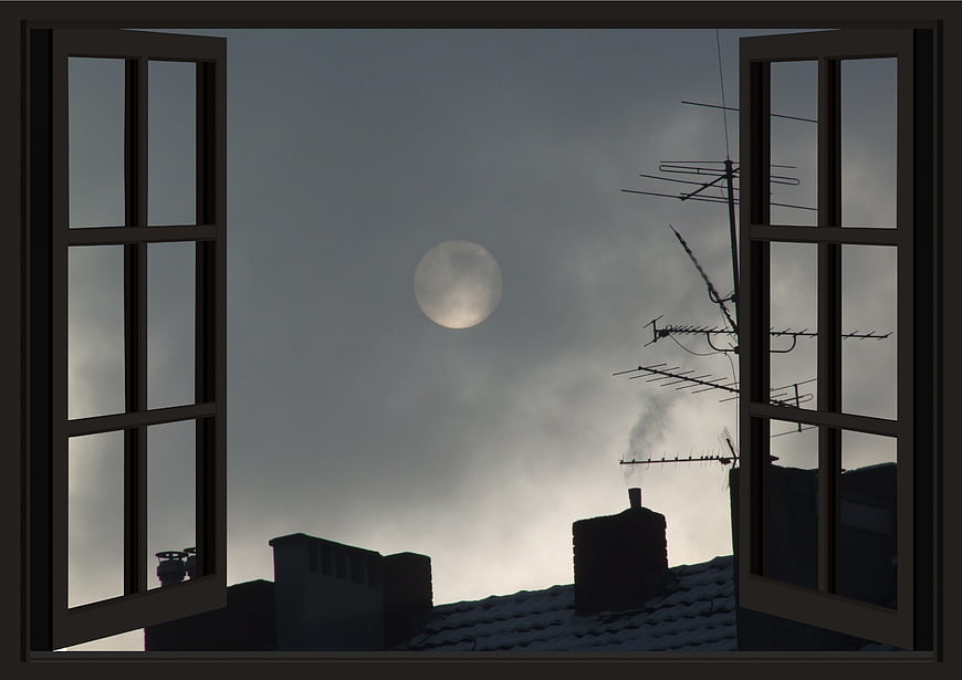 Full Moon Viewed Through Open Window With Rooftop Silhouettes