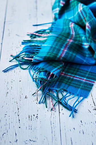 Blue Tartan Scarf on White Wooden Background