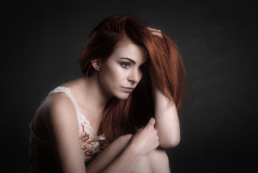 Melancholic Portrait of Young Woman with Red Hair