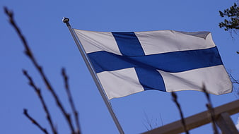 Finnish flag waving against clear blue sky