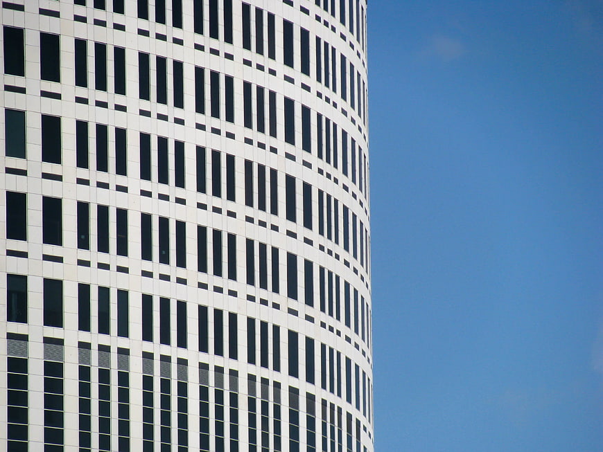 Modern Curved Skyscraper Facade Against Blue Sky