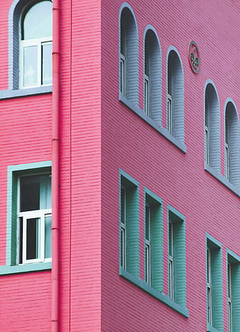 Colorful Pink and Teal Brick Building Facade