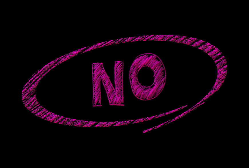 Pink chalk text no circled on black background
