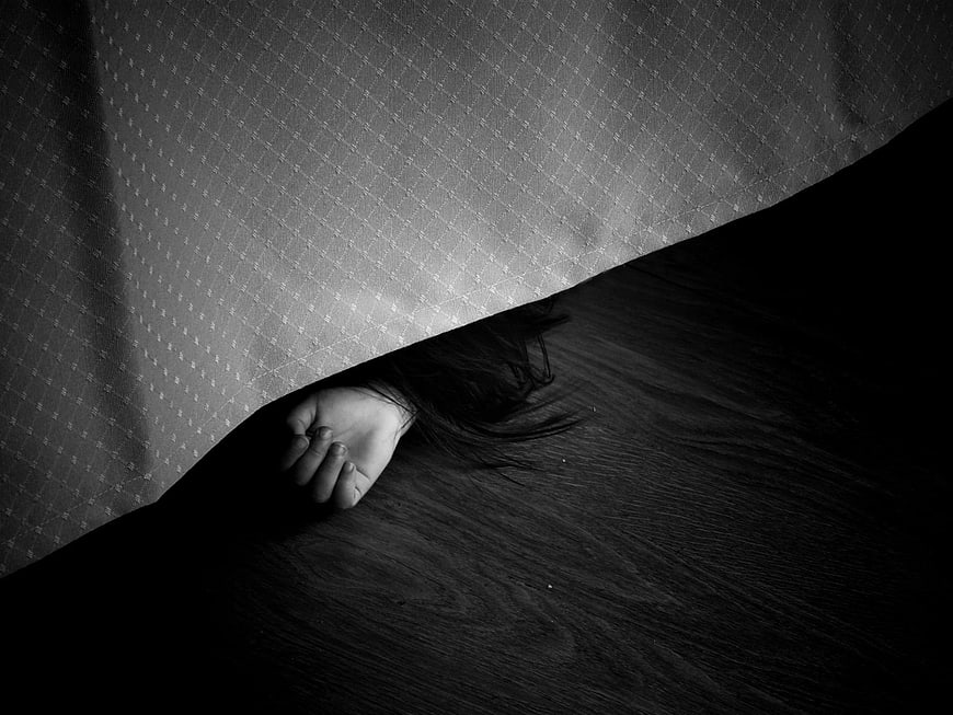 Hand Hiding Under Tablecloth in Black and White
