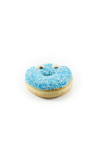Blue Frosted Donut with Candy Eyes on White Background