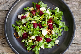 Overhead view of fresh beetroot and pear salad with lentils