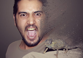 Man screaming with chameleon dissolving into dust