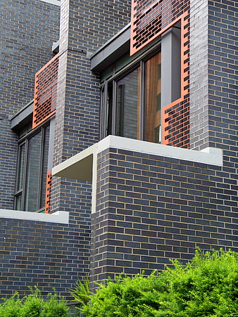 Modern Brick Building Exterior with Orange Accents