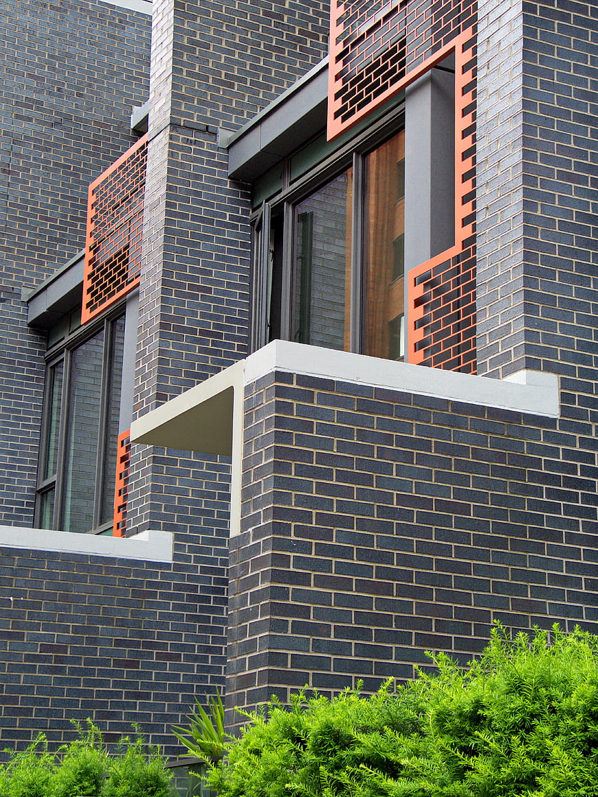 Modern Brick Building Exterior with Orange Accents