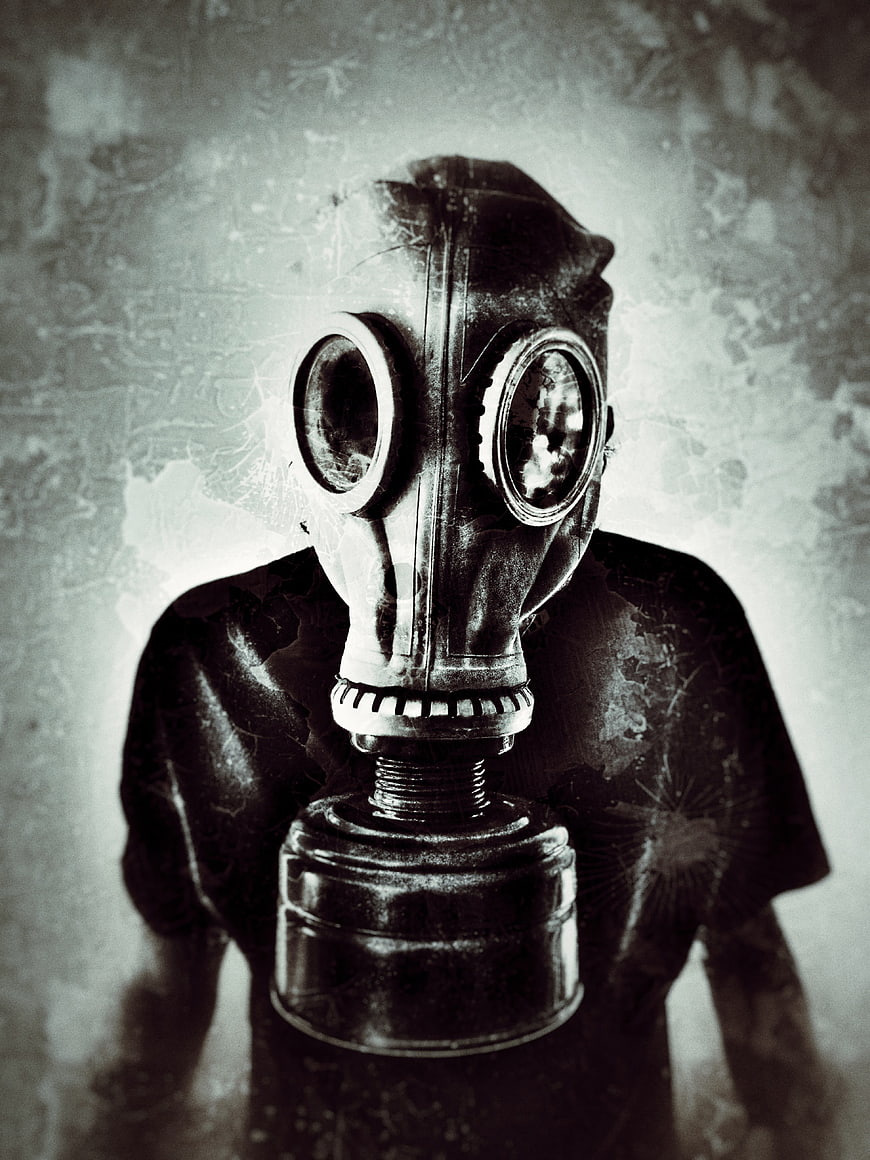 Man Wearing Vintage Gas Mask with Grunge Texture