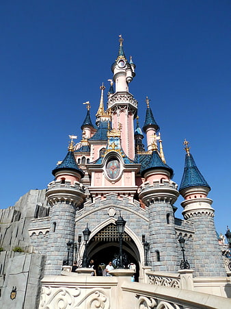 Sleeping Beauty Castle at Disneyland Paris Under Clear Blue Sky
