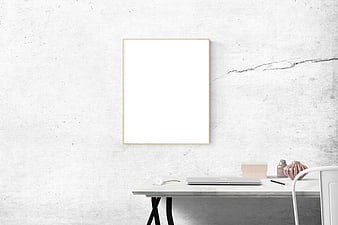Minimalist white office desk with blank picture frame mockup