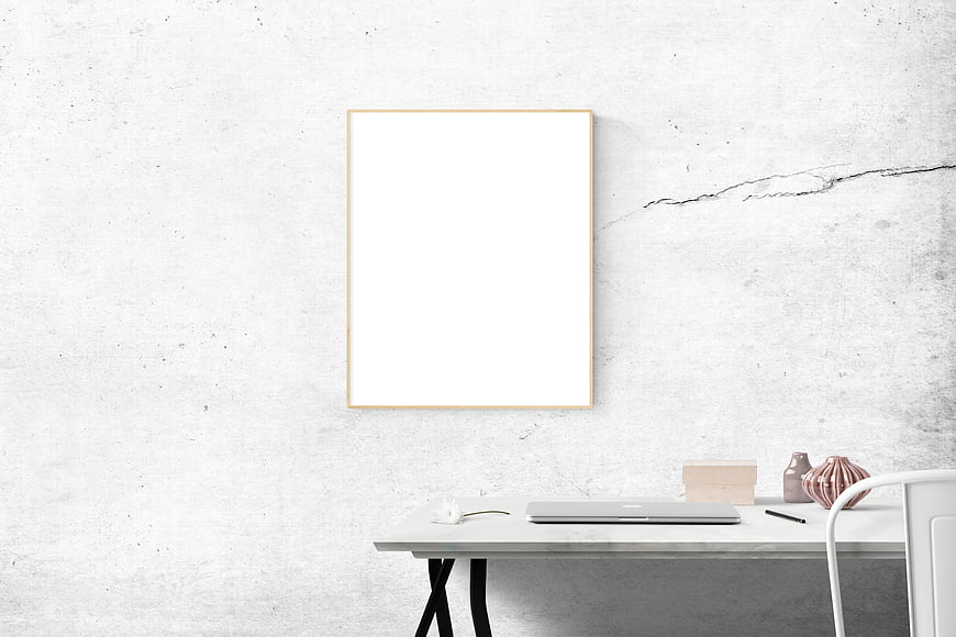Minimalist white office desk with blank picture frame mockup