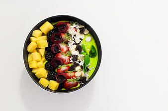 Top View of Green Smoothie Bowl with Fresh Fruits