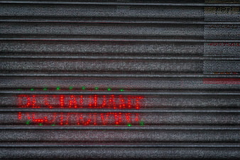 Red LED Open Sign on Perforated Metal Restaurant Wall