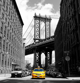 Yellow Taxi Cab on Street with Manhattan Bridge Background