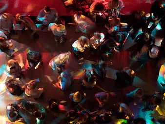Aerial View of Crowd Dancing in Colorful Disco Lights