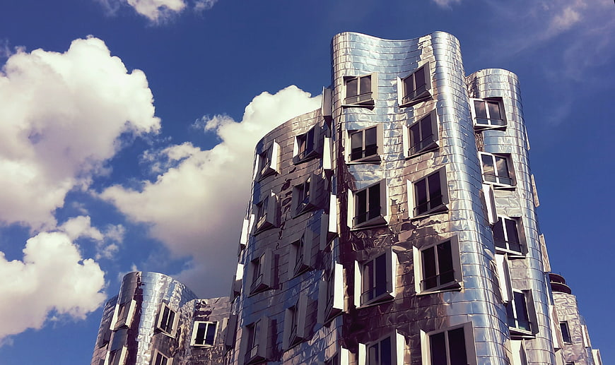 Modern Silver Metal Architecture Building with Blue Sky