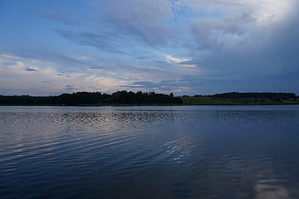 Serene Lake Landscape at Dusk with Cloudy Sky