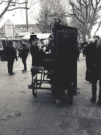 Street Musician Playing Piano in Public Square