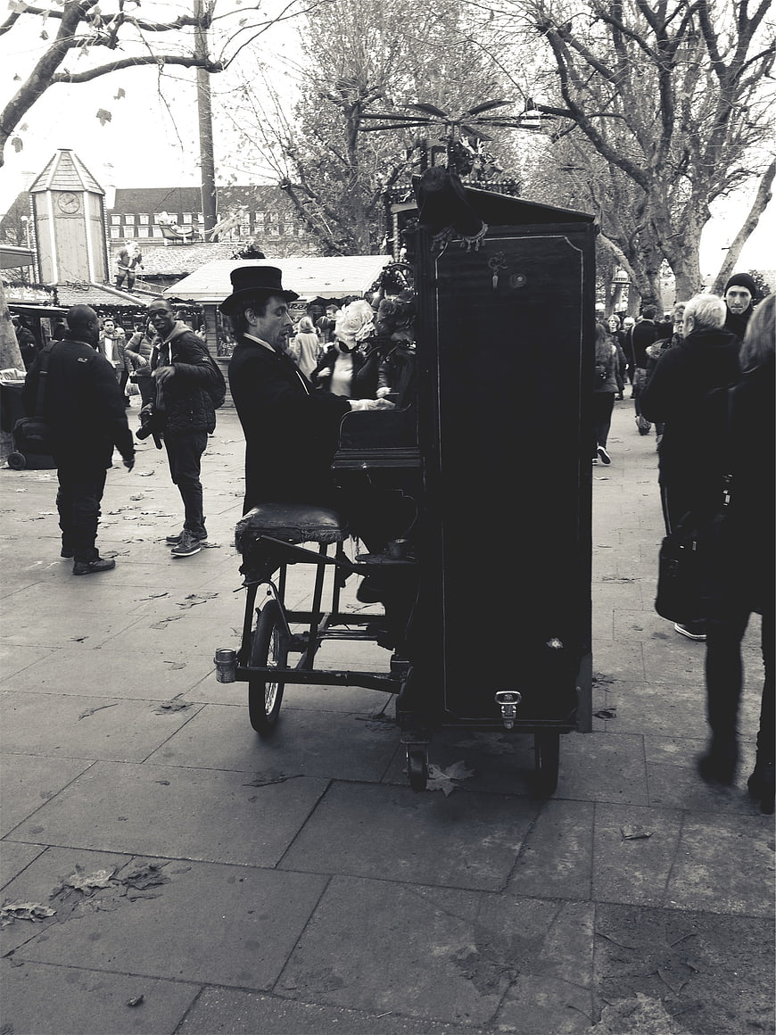 Street Musician Playing Piano in Public Square