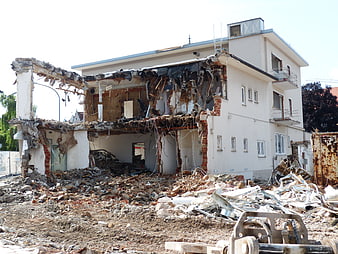 Demolished Residential Building With Rubble And Debris