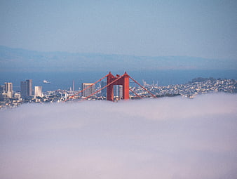 Golden Gate Bridge Rising Above Thick Fog in San Francisco