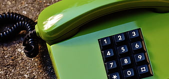 Close-up of Vintage Green Retro Telephone on Gravel