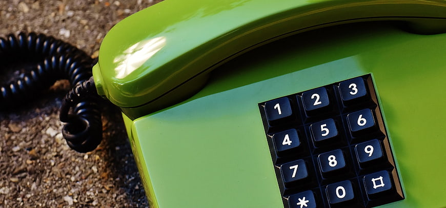 Close-up of Vintage Green Retro Telephone on Gravel