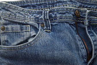 Close-up of blue denim jeans texture with pocket and zipper