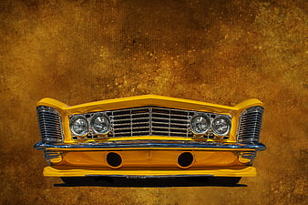 Front View Of A Classic Yellow Car Against A Textured Brown Background
