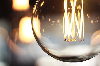 Close-up of glowing vintage filament light bulb