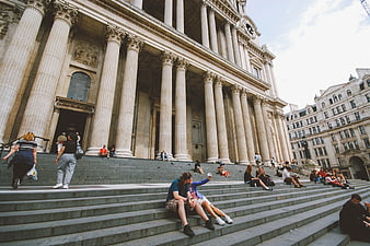 Tourists taking selfie on steps of St Paul's Cathedral London