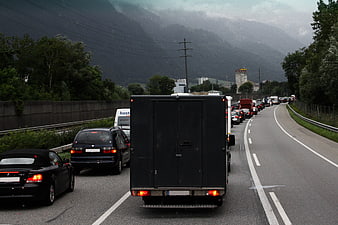 Traffic Jam On Mountain Highway With Dark Clouds