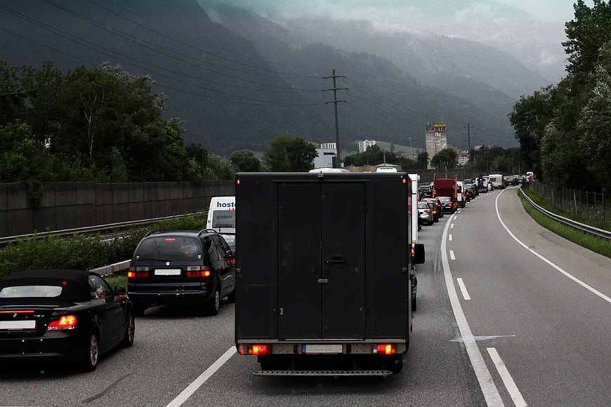Traffic Jam On Mountain Highway With Dark Clouds