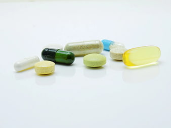 Assorted Vitamins and Supplements on White Background