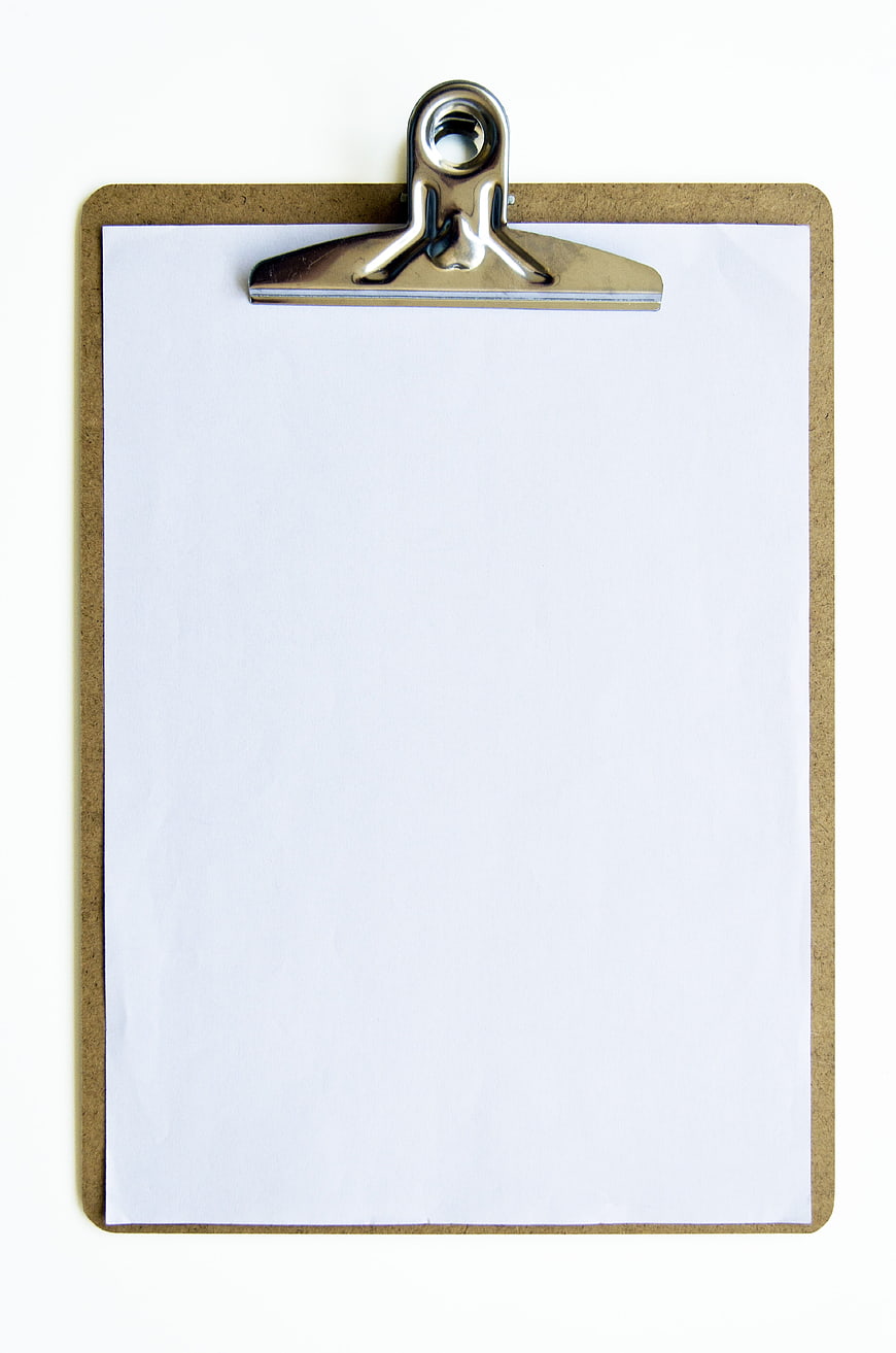 Blank clipboard with white paper on white background