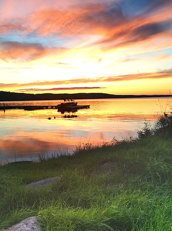 Serene Lake Sunset with Dock and Vibrant Sky