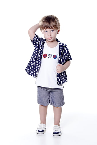 Young boy in nautical summer outfit studio portrait