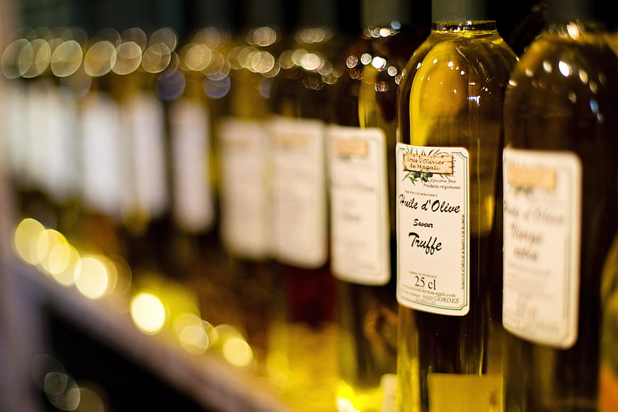 Close-up of Gourmet Truffle Olive Oil Bottles on Shelf