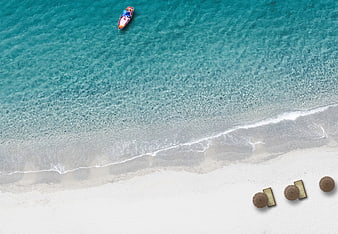 Aerial View of Turquoise Beach with Longtail Boat and Sunbeds