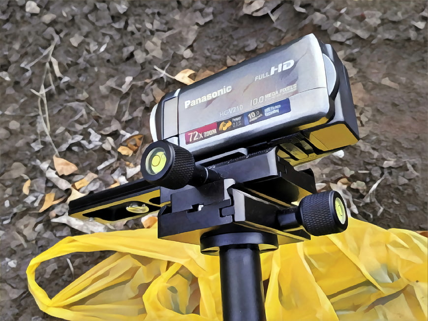 Panasonic Camcorder on Tripod with Yellow Background