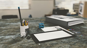 Digital Art Workspace with Graphics Tablet and Photoshop Cube