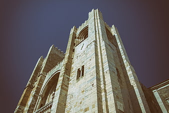 Low angle view of historic stone church tower in Lisbon