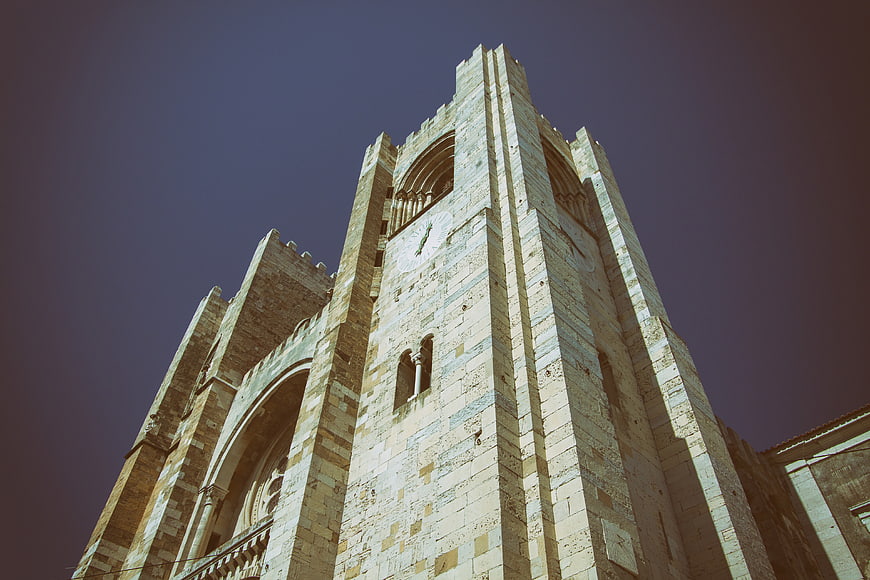 Low angle view of historic stone church tower in Lisbon