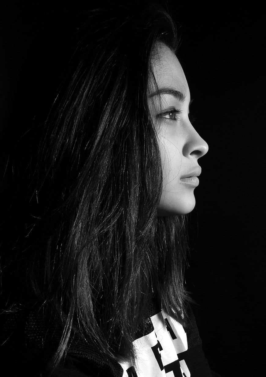 Black and white profile portrait of a woman with long hair